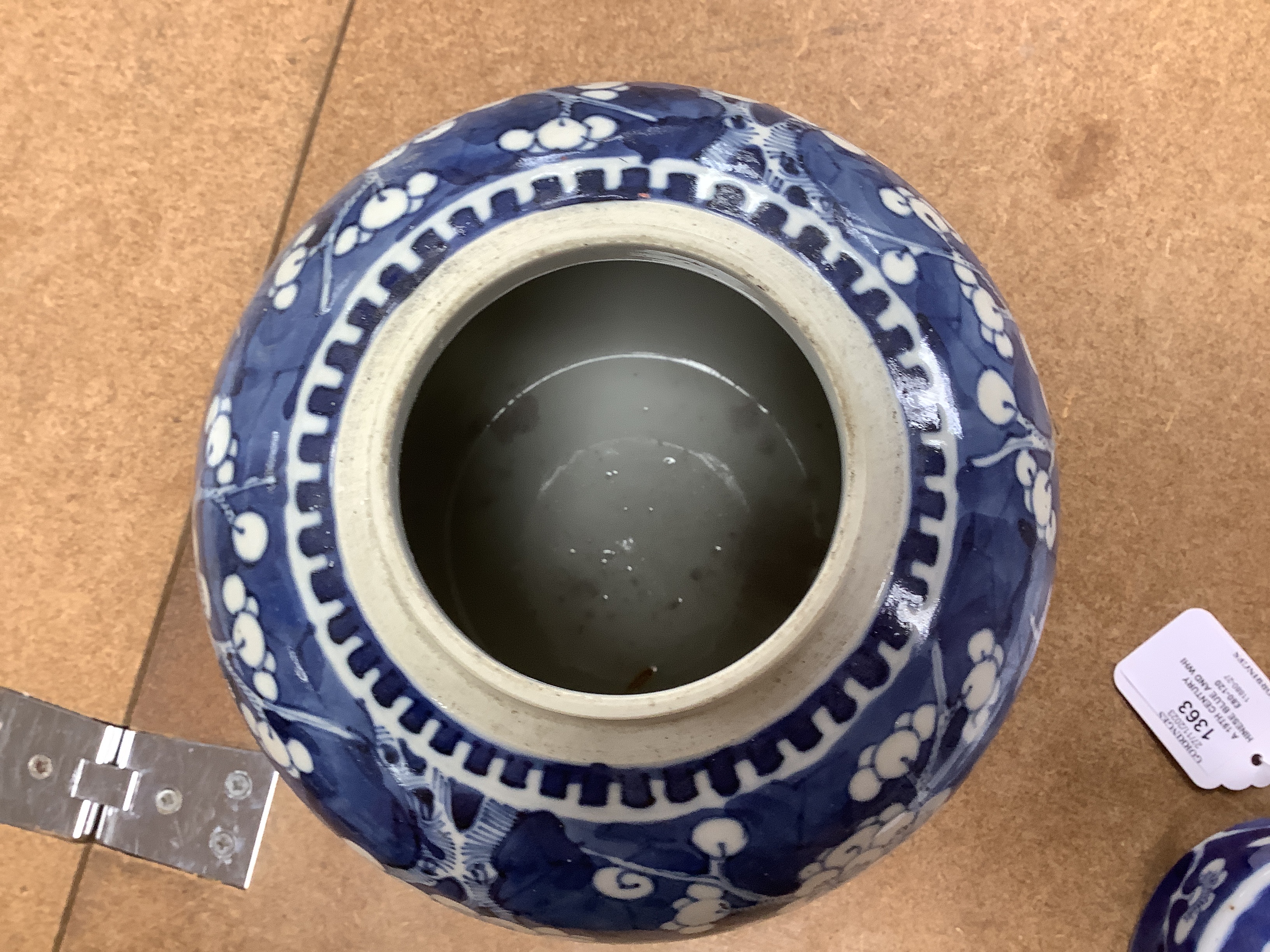 A 19th century Chinese blue and white prunus jar and cover, together with two similar tiles, jar 21cm